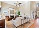 Spacious living room with fireplace, plush seating, and natural light at 149 Country Mill Way, Fuquay Varina, NC 27526