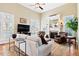 Bright living room with a fireplace, large windows, and vaulted ceilings at 149 Country Mill Way, Fuquay Varina, NC 27526