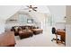 Cozy living room featuring wainscoting, vaulted ceilings, and a ceiling fan at 149 Country Mill Way, Fuquay Varina, NC 27526