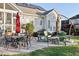 Back patio with string lights, seating, a grill, and views of the backyard at 149 Country Mill Way, Fuquay Varina, NC 27526