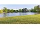 Scenic pond view surrounded by manicured lawns and mature trees within the community at 149 Country Mill Way, Fuquay Varina, NC 27526