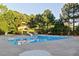 Community pool with a water slide, slide and surrounding sun deck at 149 Country Mill Way, Fuquay Varina, NC 27526