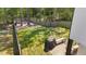 Expansive fenced backyard with lush lawn, fire pit, and patio area perfect for outdoor entertaining at 166 Yellow Jacket Rdg, Clayton, NC 27520