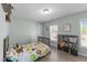 Bright bedroom with a zoo animal motif and laminate floors at 166 Yellow Jacket Rdg, Clayton, NC 27520