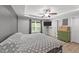 Cozy bedroom with tray ceilings, a ceiling fan, hard wood floors, and natural light at 166 Yellow Jacket Rdg, Clayton, NC 27520
