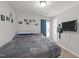 Bedroom showcasing a cozy bed and a mounted television at 166 Yellow Jacket Rdg, Clayton, NC 27520