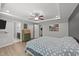 Cozy bedroom with tray ceilings, a ceiling fan, hard wood floors, and natural light at 166 Yellow Jacket Rdg, Clayton, NC 27520
