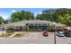 Exterior of Lionsgate community clubhouse with ample parking and manicured landscaping at 166 Yellow Jacket Rdg, Clayton, NC 27520