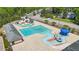 Aerial view of large community pool featuring slides, bridges, and lane swimming at 166 Yellow Jacket Rdg, Clayton, NC 27520
