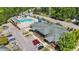 Aerial view of community pool with water slides, swimming lanes, and recreational water area at 166 Yellow Jacket Rdg, Clayton, NC 27520