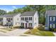 Charming two-story home with a well-manicured lawn, a concrete driveway, and classic black shutters at 166 Yellow Jacket Rdg, Clayton, NC 27520