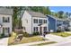 Two-story home with black shutters, a concrete driveway, a well-manicured lawn, and mature trees at 166 Yellow Jacket Rdg, Clayton, NC 27520