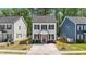 Charming two-story home with white siding, black shutters, a red front door, and a well-manicured front lawn at 166 Yellow Jacket Rdg, Clayton, NC 27520