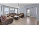 Comfortable living room with hardwood floors, neutral walls, a ceiling fan, and an arched doorway at 166 Yellow Jacket Rdg, Clayton, NC 27520