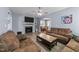 Cozy living room featuring a fireplace, hardwood floors, neutral walls, and dining area access at 166 Yellow Jacket Rdg, Clayton, NC 27520