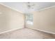 Simple bedroom with a ceiling fan and a window letting in natural light at 1729 Crawford Rd, Graham, NC 27253