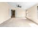 Cozy bedroom with a ceiling fan, neutral carpeting, and natural light from the window at 1729 Crawford Rd, Graham, NC 27253