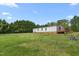 View of the house with trees in the backyard at 1729 Crawford Rd, Graham, NC 27253