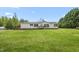 A single-story home with a well-manicured front yard and inviting curb appeal at 1729 Crawford Rd, Graham, NC 27253