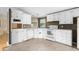 Functional kitchen with ample cabinetry, updated appliances, and durable flooring at 1729 Crawford Rd, Graham, NC 27253