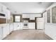 Functional kitchen with ample cabinetry, updated appliances, and durable flooring at 1729 Crawford Rd, Graham, NC 27253