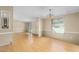 Open-concept living area with laminate floors, neutral walls, and natural light at 1729 Crawford Rd, Graham, NC 27253