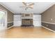 Spacious living room featuring a stone fireplace and built-in shelves for storage and decor at 1729 Crawford Rd, Graham, NC 27253