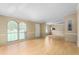 Spacious living room with laminate flooring, large windows, and open layout at 1729 Crawford Rd, Graham, NC 27253