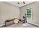 Bright, comfortable pet-friendly room with window, ceiling fan, and pet furniture at 1730 Willie Pace Rd, Burlington, NC 27217