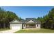 Charming single-story home with a manicured lawn and attached garage at 1730 Willie Pace Rd, Burlington, NC 27217