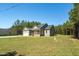 Charming single-story home with a cozy front porch and well-manicured lawn in a peaceful setting at 1730 Willie Pace Rd, Burlington, NC 27217