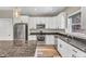 A well-equipped kitchen features stainless steel appliances, granite countertops, and ample cabinet space at 1730 Willie Pace Rd, Burlington, NC 27217