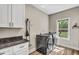 Convenient laundry room with updated appliances and cabinet storage space at 1730 Willie Pace Rd, Burlington, NC 27217