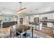Spacious open-concept living area with a kitchen island, dining table, and comfortable seating at 1730 Willie Pace Rd, Burlington, NC 27217