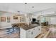 Open-concept living area with a kitchen island, dining area, and modern finishes at 1730 Willie Pace Rd, Burlington, NC 27217