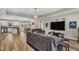 Spacious open-concept living room with hardwood floors, tray ceiling, and modern furnishings at 1730 Willie Pace Rd, Burlington, NC 27217