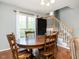 Cozy dining area with hardwood floors and staircase at 1850 Crissy Ln, Graham, NC 27253