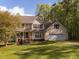 Charming two-story home with a front porch and a well-maintained lawn at 1850 Crissy Ln, Graham, NC 27253
