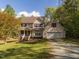 Charming two-story home with a well-manicured lawn and a two car garage at 1850 Crissy Ln, Graham, NC 27253