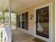 Charming front porch with a 'Welcome' sign, complemented by a window and view of the outdoors at 1850 Crissy Ln, Graham, NC 27253