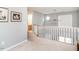 Upstairs loft area, with railing and view downstairs at 1850 Crissy Ln, Graham, NC 27253