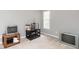 Loft area with carpet flooring and multiple TV sets on display shelves at 1850 Crissy Ln, Graham, NC 27253