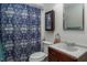 Bathroom has a vanity with dark wood cabinets and a shower-tub combo at 200 W Woodcroft Pkwy # 45C, Durham, NC 27713