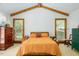Bright bedroom with vaulted ceilings, exposed beams, and two large windows at 200 W Woodcroft Pkwy # 45C, Durham, NC 27713