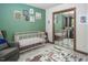 Bedroom boasts a crib, a comfortable glider, and a mirrored closet at 200 W Woodcroft Pkwy # 45C, Durham, NC 27713