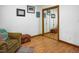 Sitting area features a mirrored closet, comfortable chair and bright natural light at 200 W Woodcroft Pkwy # 45C, Durham, NC 27713