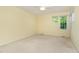 Bedroom with a large window overlooking nature, providing ample natural light at 201 Lakewater Dr, Cary, NC 27511