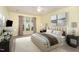 Bright bedroom with neutral décor, large bed, stylish nightstands, and serene artwork at 201 Lakewater Dr, Cary, NC 27511
