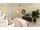 Decorated bedroom featuring a ceiling fan, hardwood flooring, and a furnished bed with a dresser at 201 Lakewater Dr, Cary, NC 27511