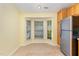 Charming breakfast nook featuring natural light, a bay window, tile flooring, and a stainless fridge at 201 Lakewater Dr, Cary, NC 27511